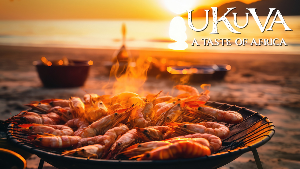 Flambe prawns on a sunset beach